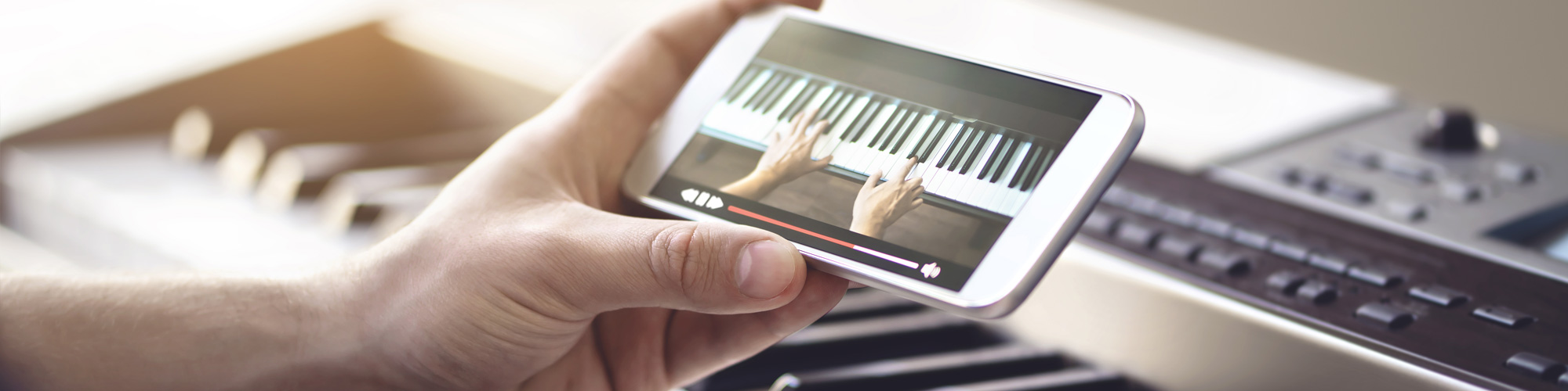 Student viewing an online piano lessons video